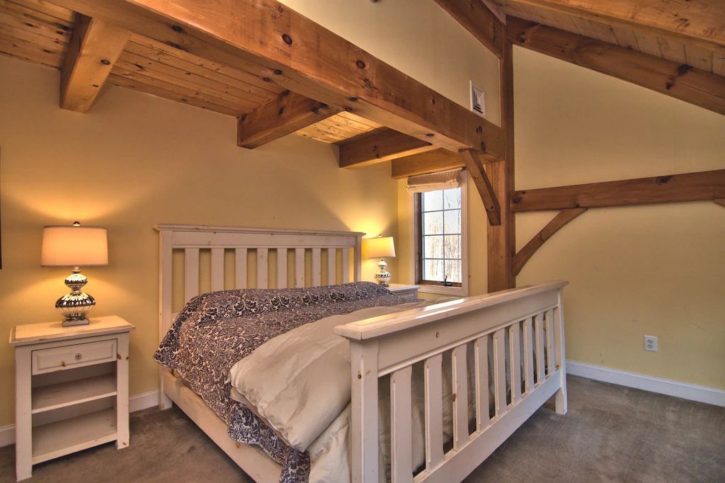 A bedroom with a king size bed and two nightstands