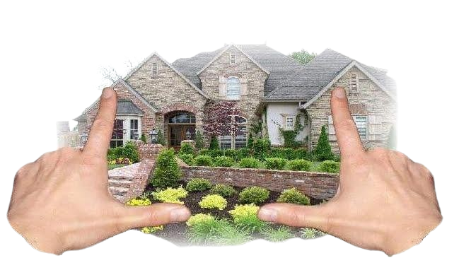 Hands framing a stone house with manicured landscaping.