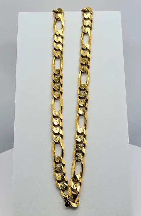 Two gold chain necklaces draped on a white display stand