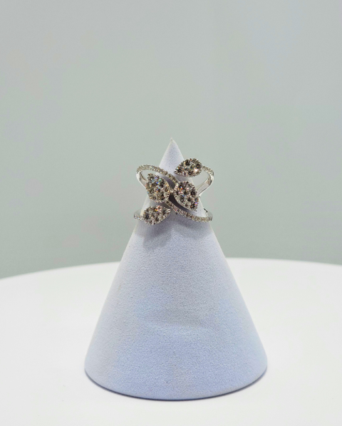 Silver floral ring with clear stones displayed on a pale blue cone stand against a light gray background
