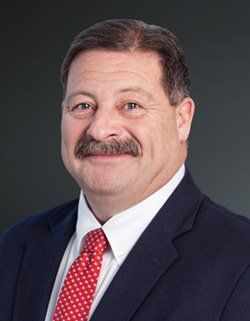 headshot of Tom Higgins, council president