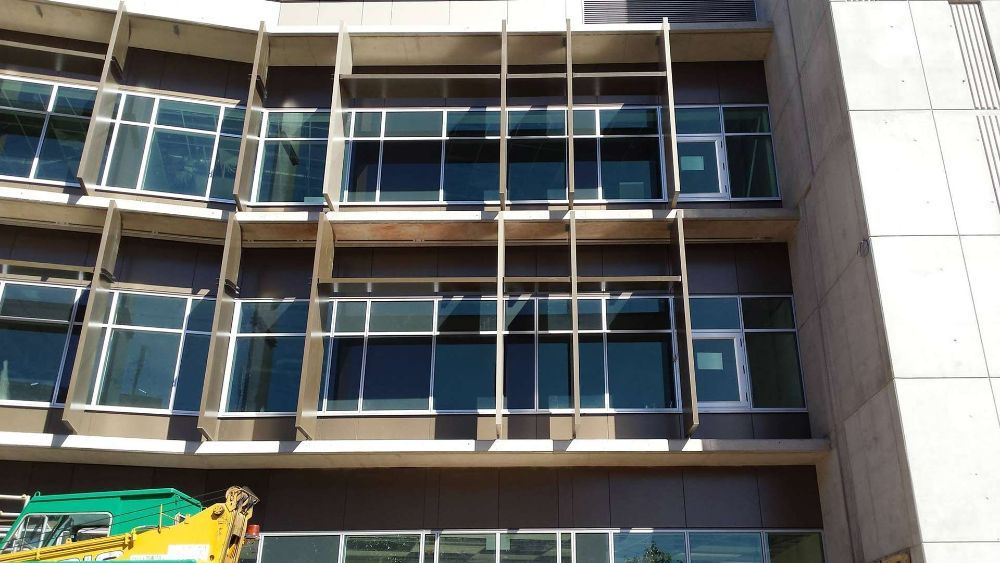A Building with A Lot of Windows — North Queensland Glass & Glazing In Cannonvale, QLD