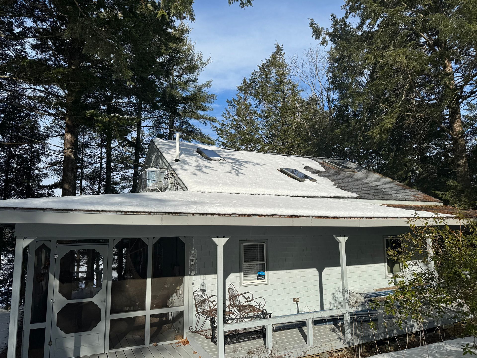 a house with a front porch and a new roof