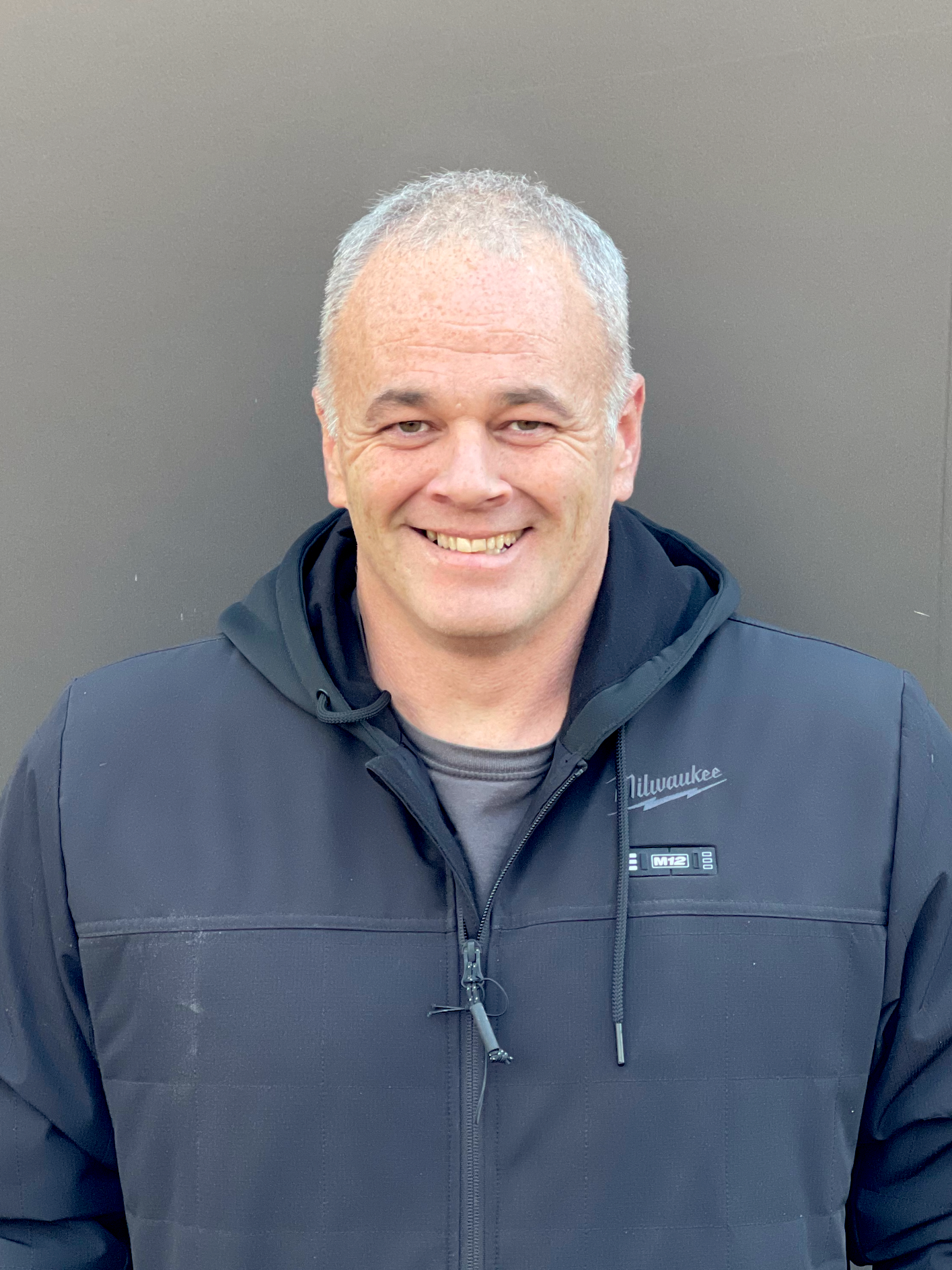 a picture of a man in a black milwaukee jacket