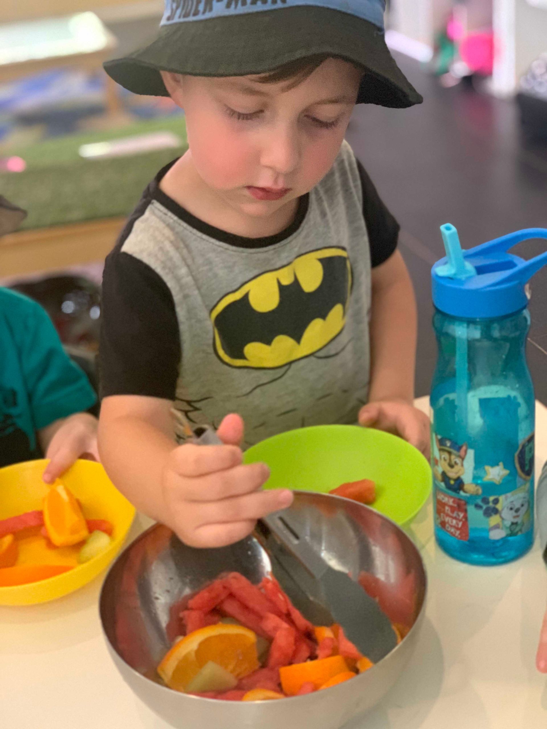 Little Boy Eating Fruits — Macarthur, ACT — TeddyBears Childcare Centre