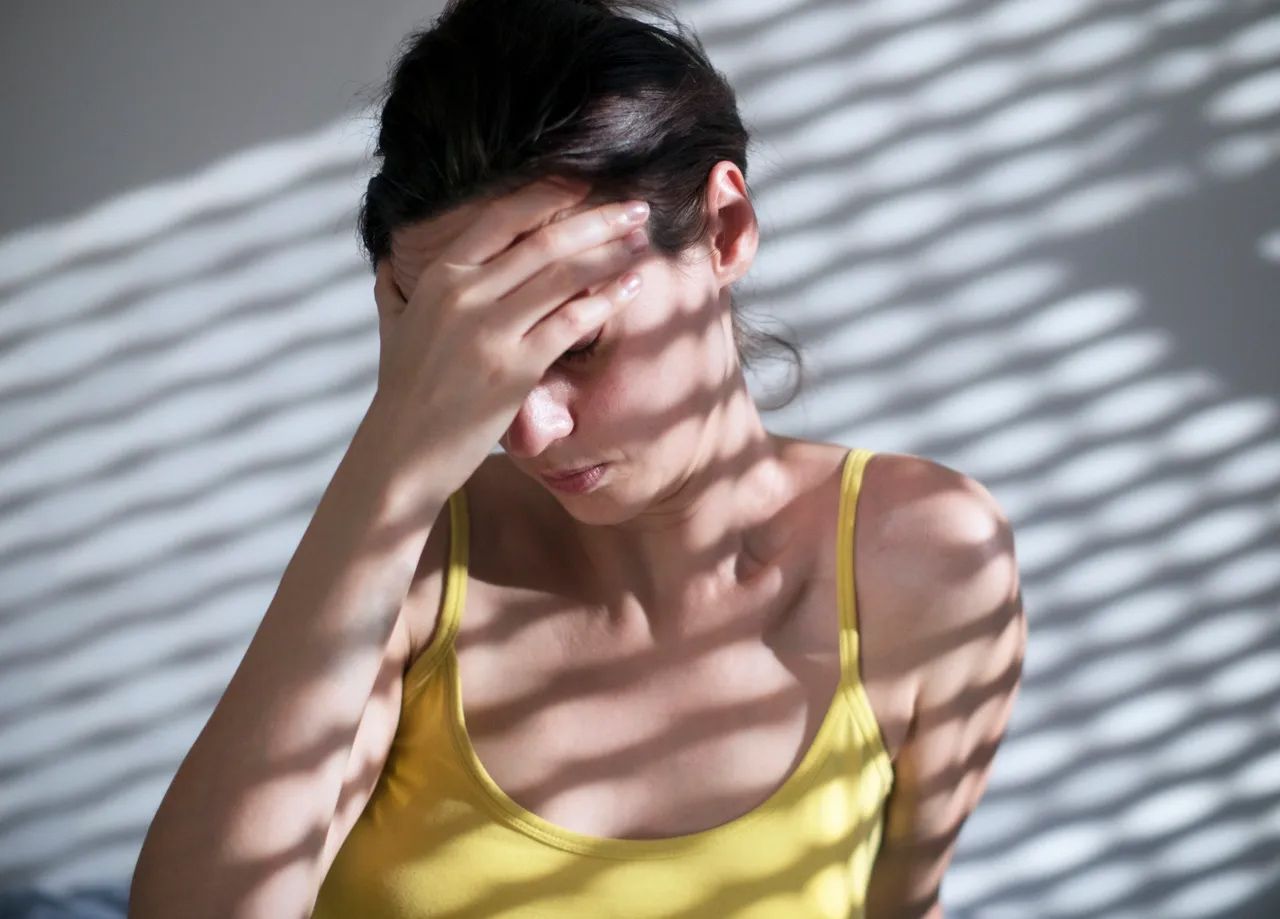 Woman experiencing headache