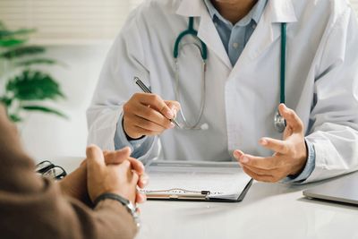 Doctor speaking with a patient at a desk