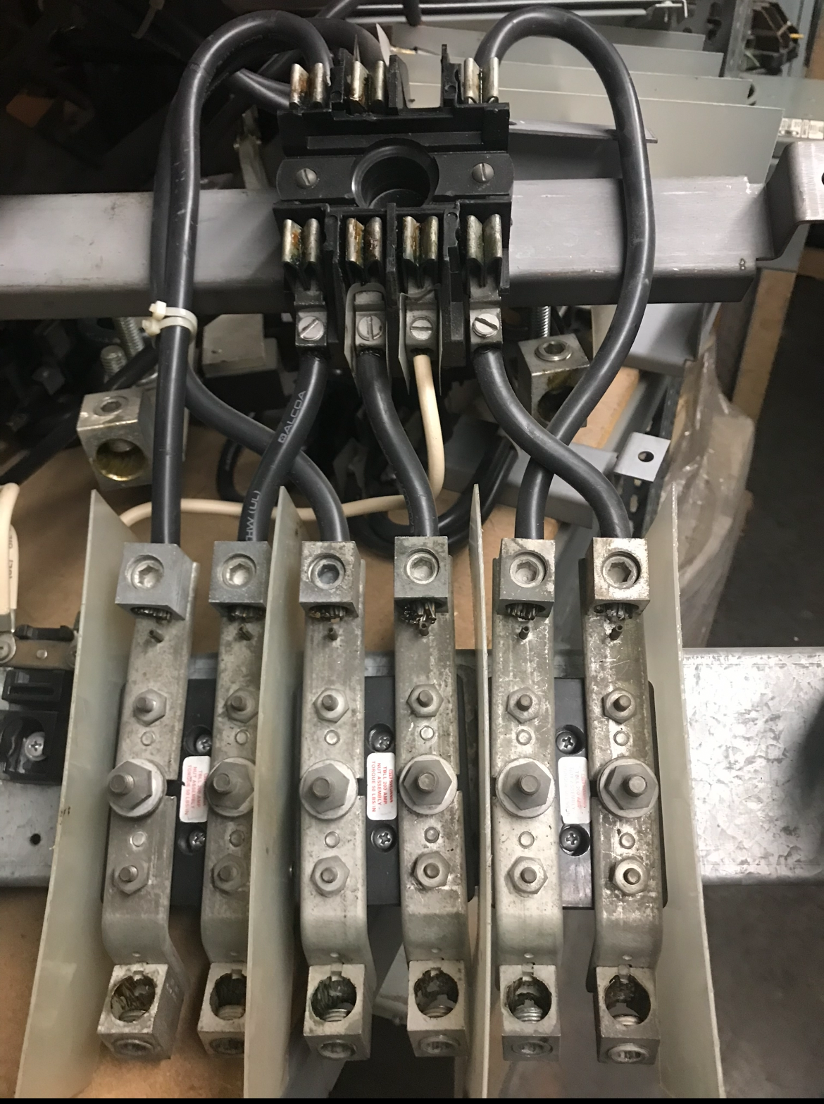 Electrical components with wires and terminals, likely a motor starter or similar device.