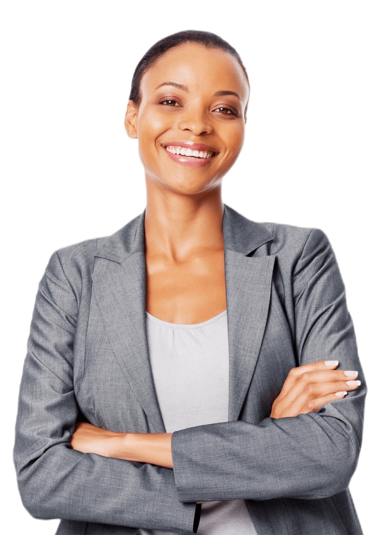 A woman in a grey suit is smiling with her arms crossed