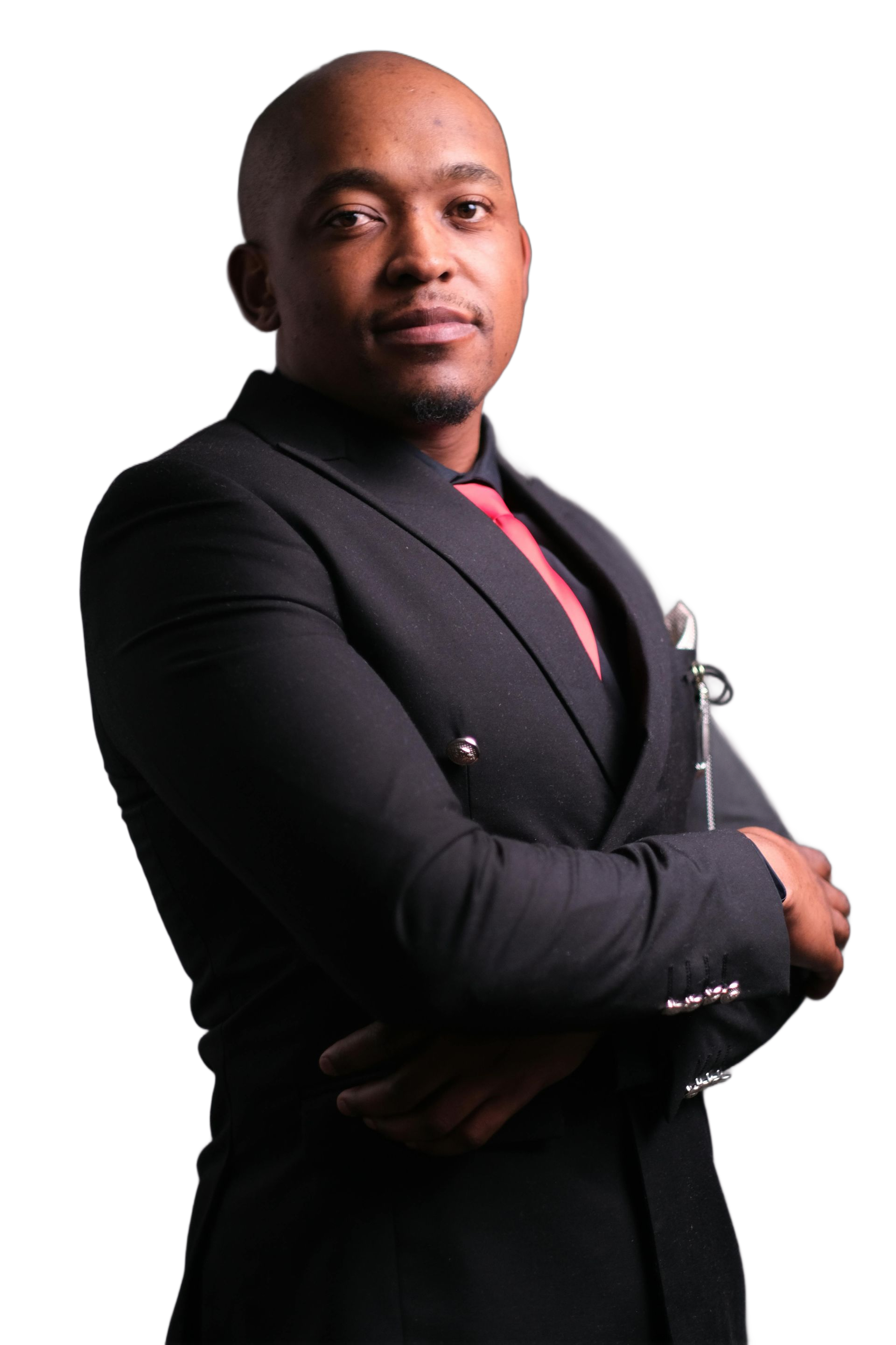 Man in black suit, arms crossed, red tie.