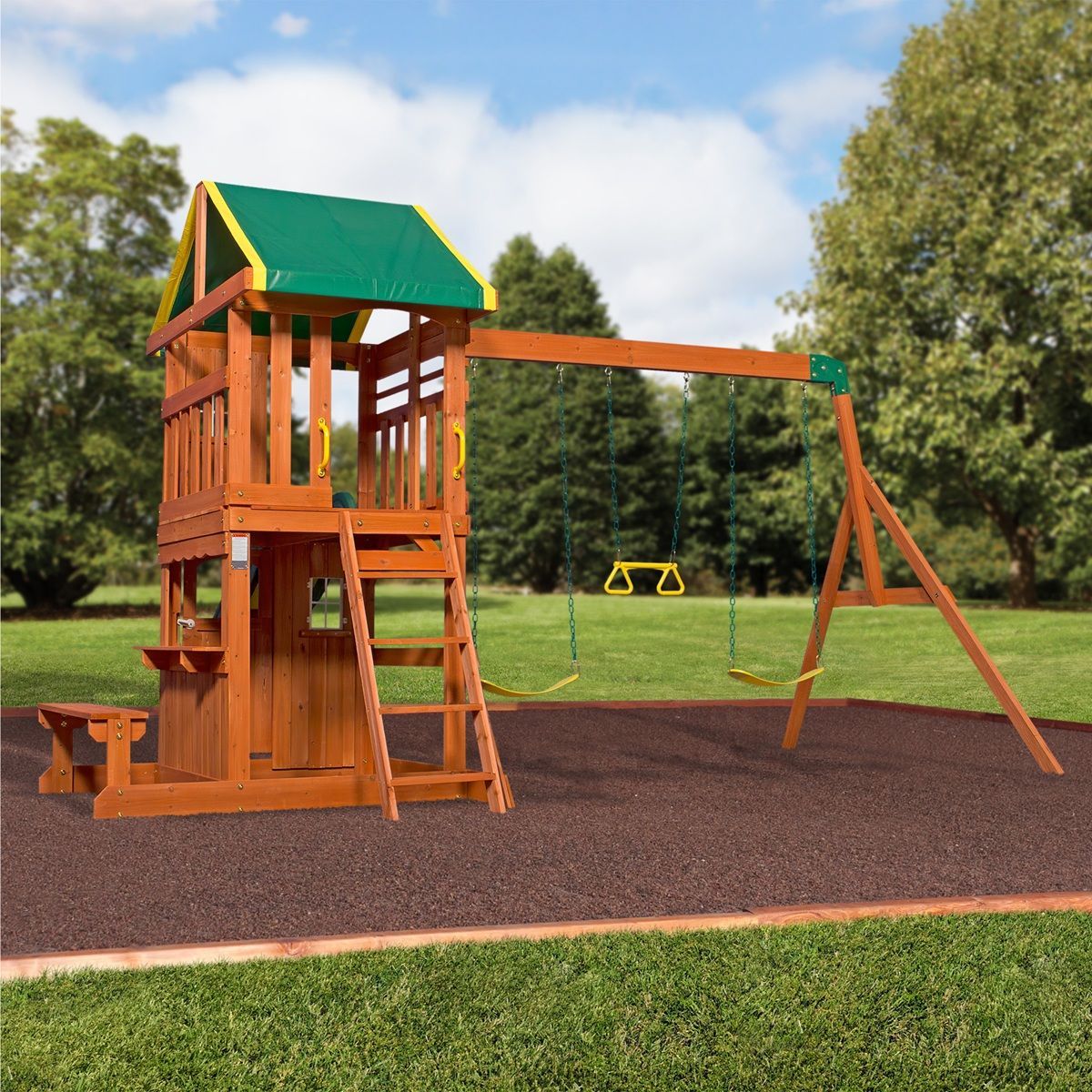 Wooden playground tower with slide and swings on a park lawn under a green roof