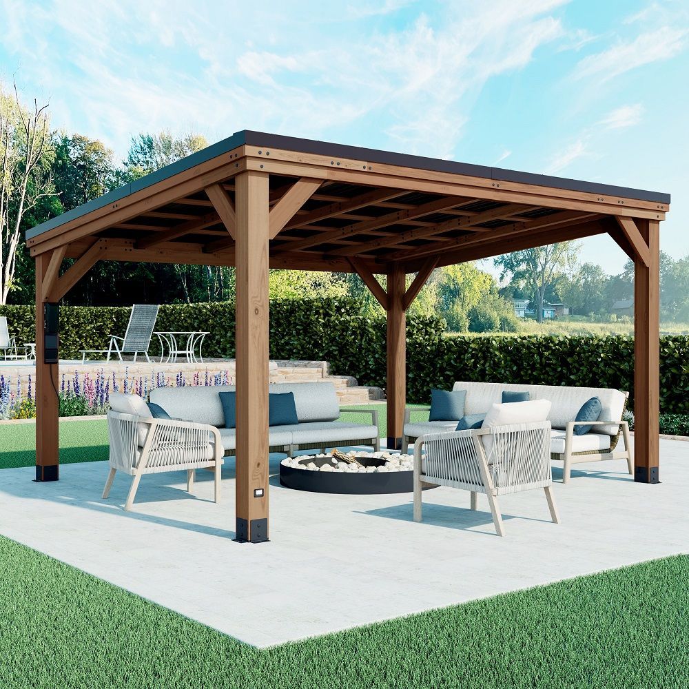 Wooden outdoor gazebo with white lounge seating around a fire pit on a patio by a pool