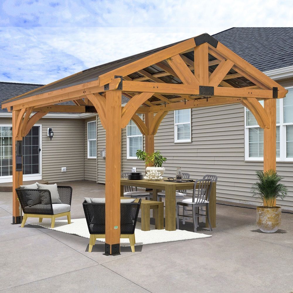 Wooden gazebo patio with outdoor dining table and chairs on a concrete backyard
