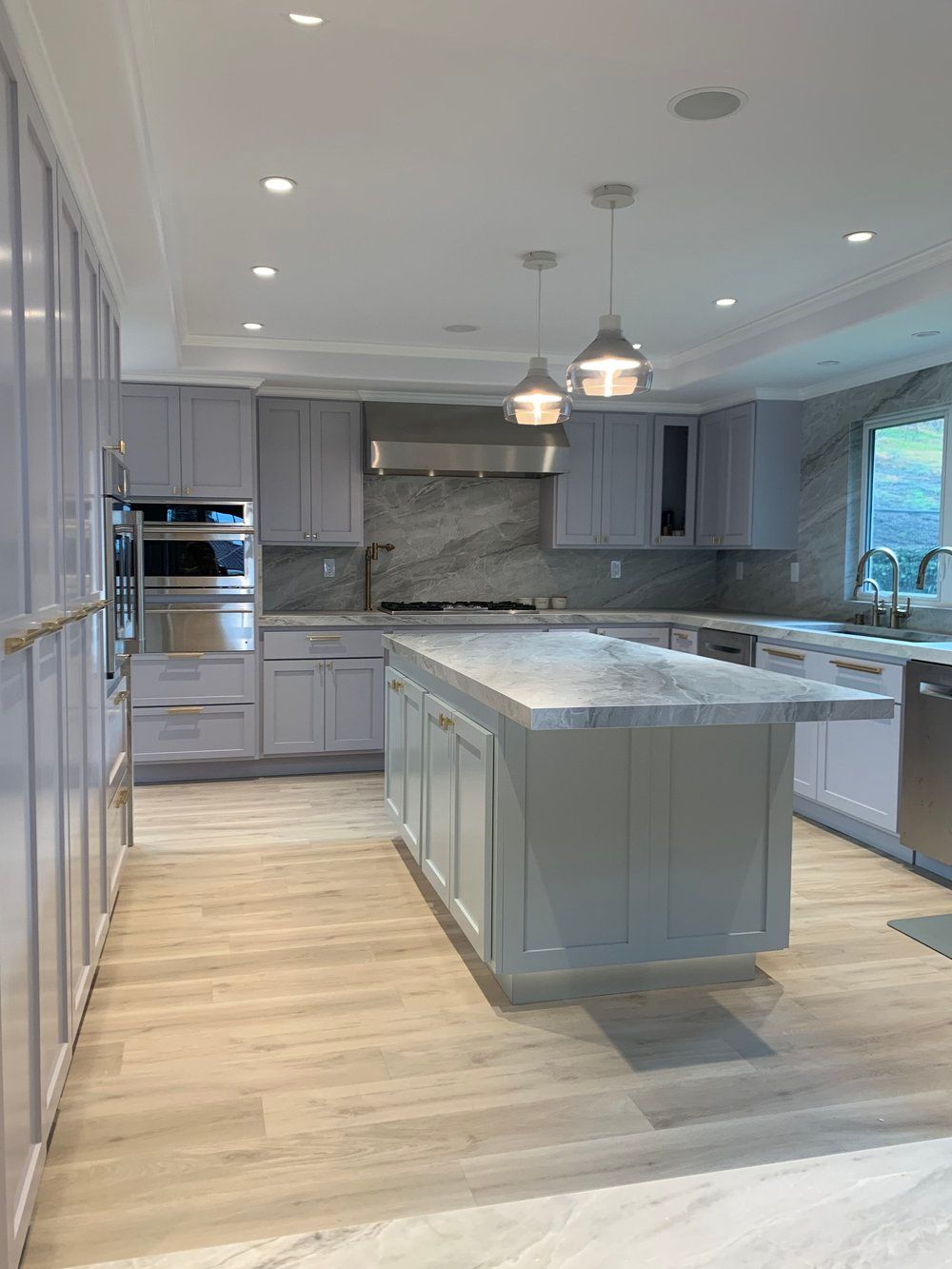 Custom kitchen with integrated cabinet lighting