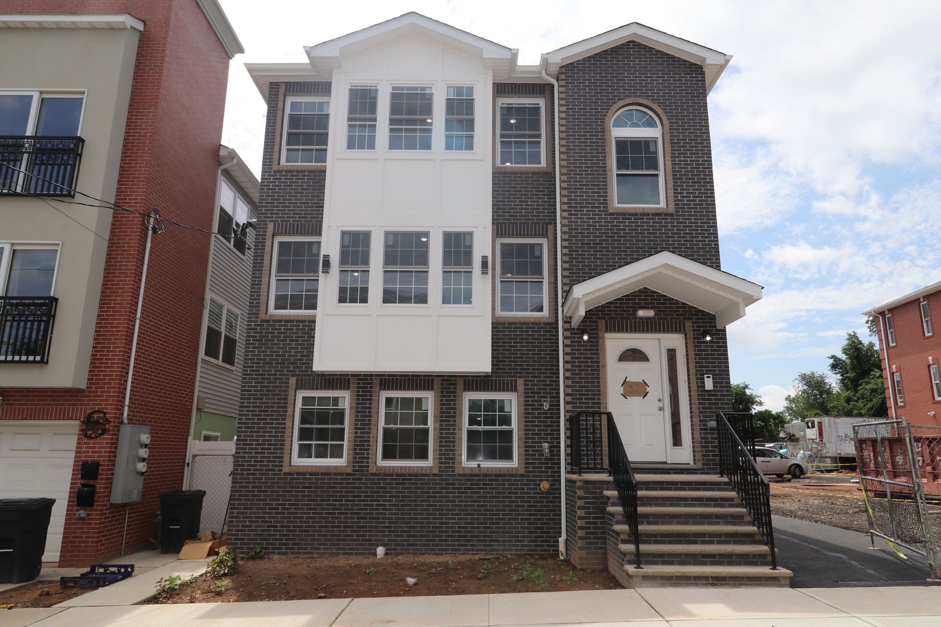 A large house with a lot of windows and stairs