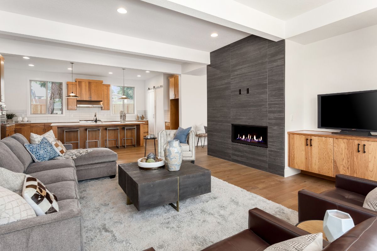 A living room filled with furniture and a fireplace.