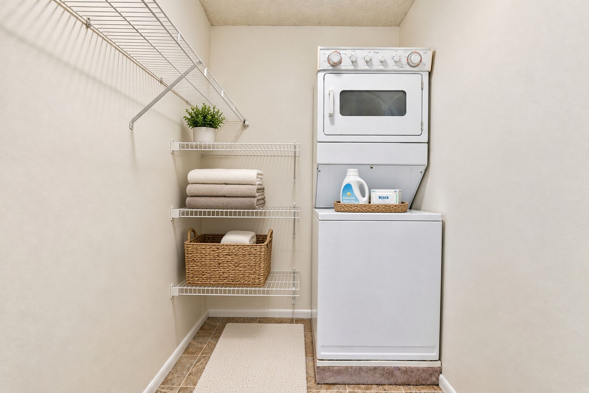 In-unit laundry with tile floor at The Groves apartments