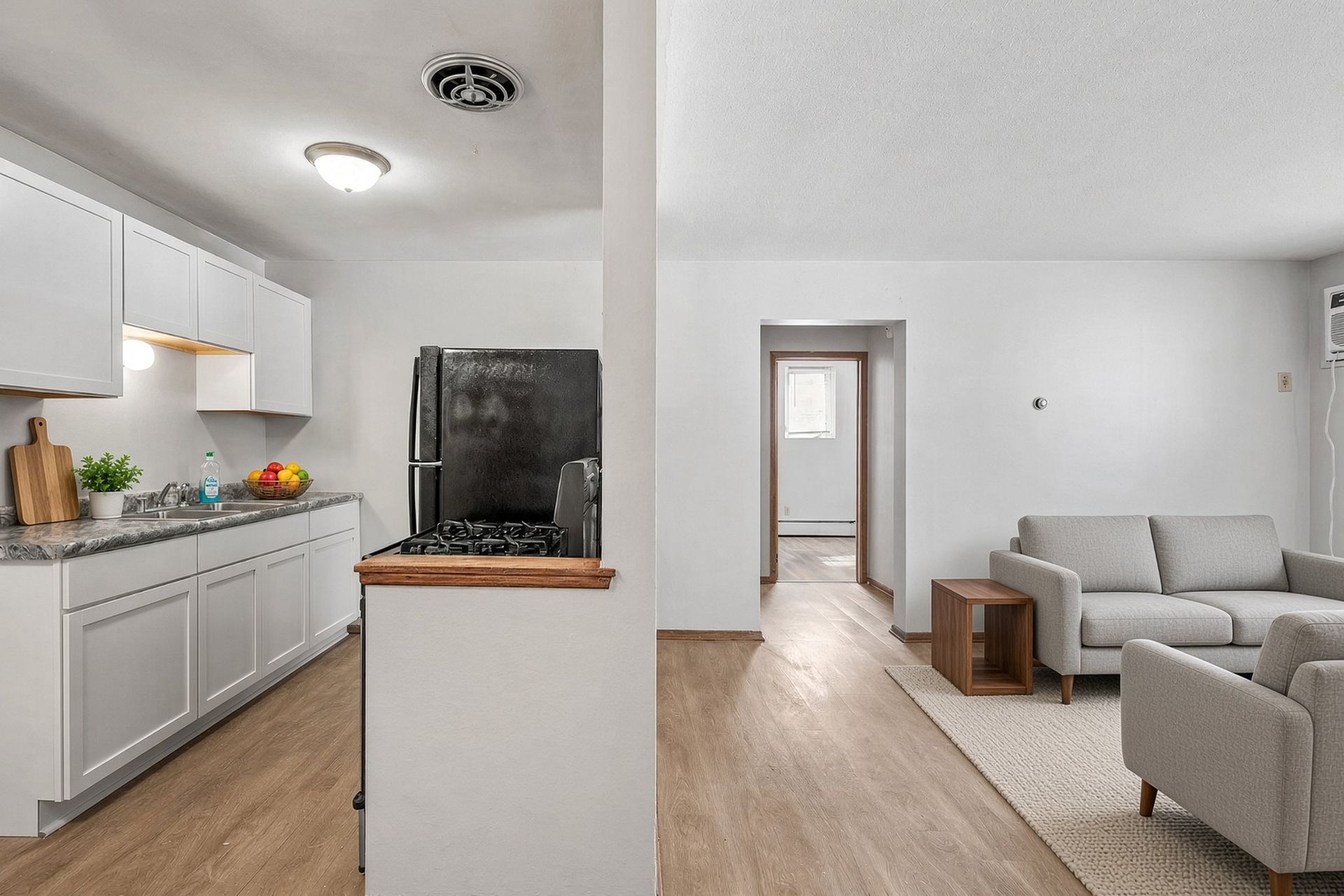 Kitchen looking into the living room at Hanson Court apartments
