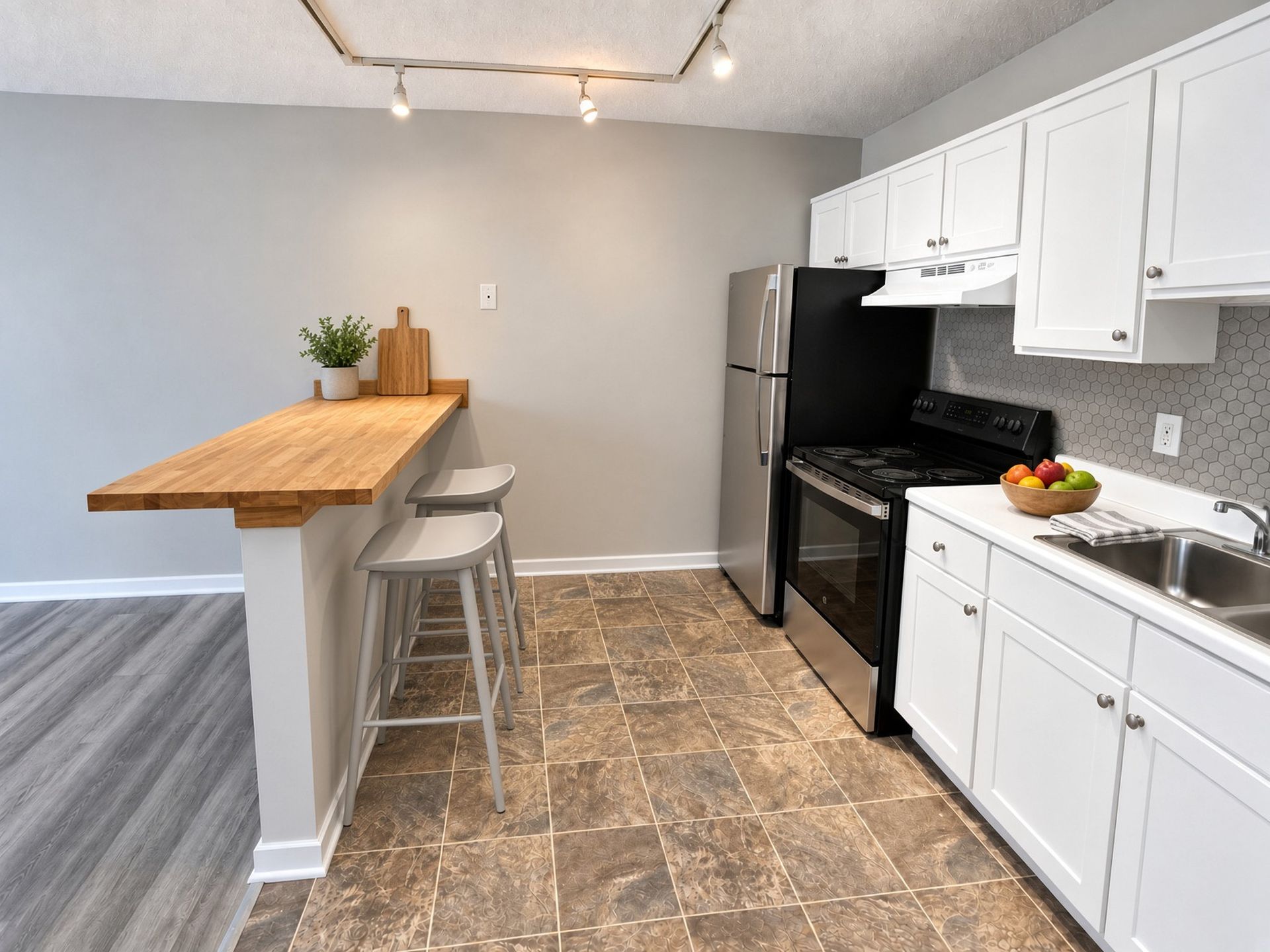 Kitchen with breakfast bar at The Groves apartments