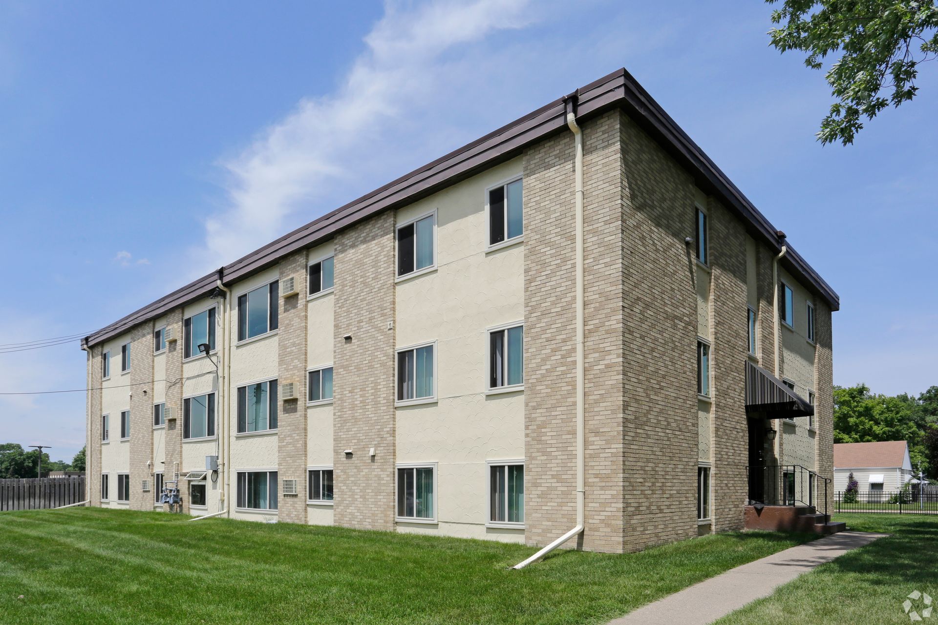 A large apartment building with a lot of windows