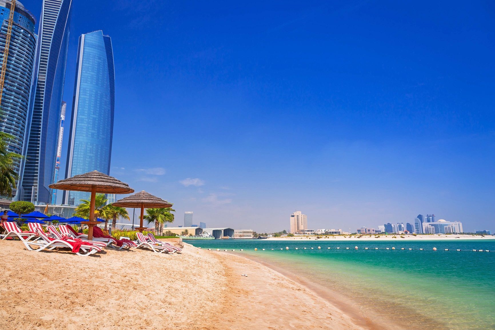 There are many chairs and umbrellas on the beach.