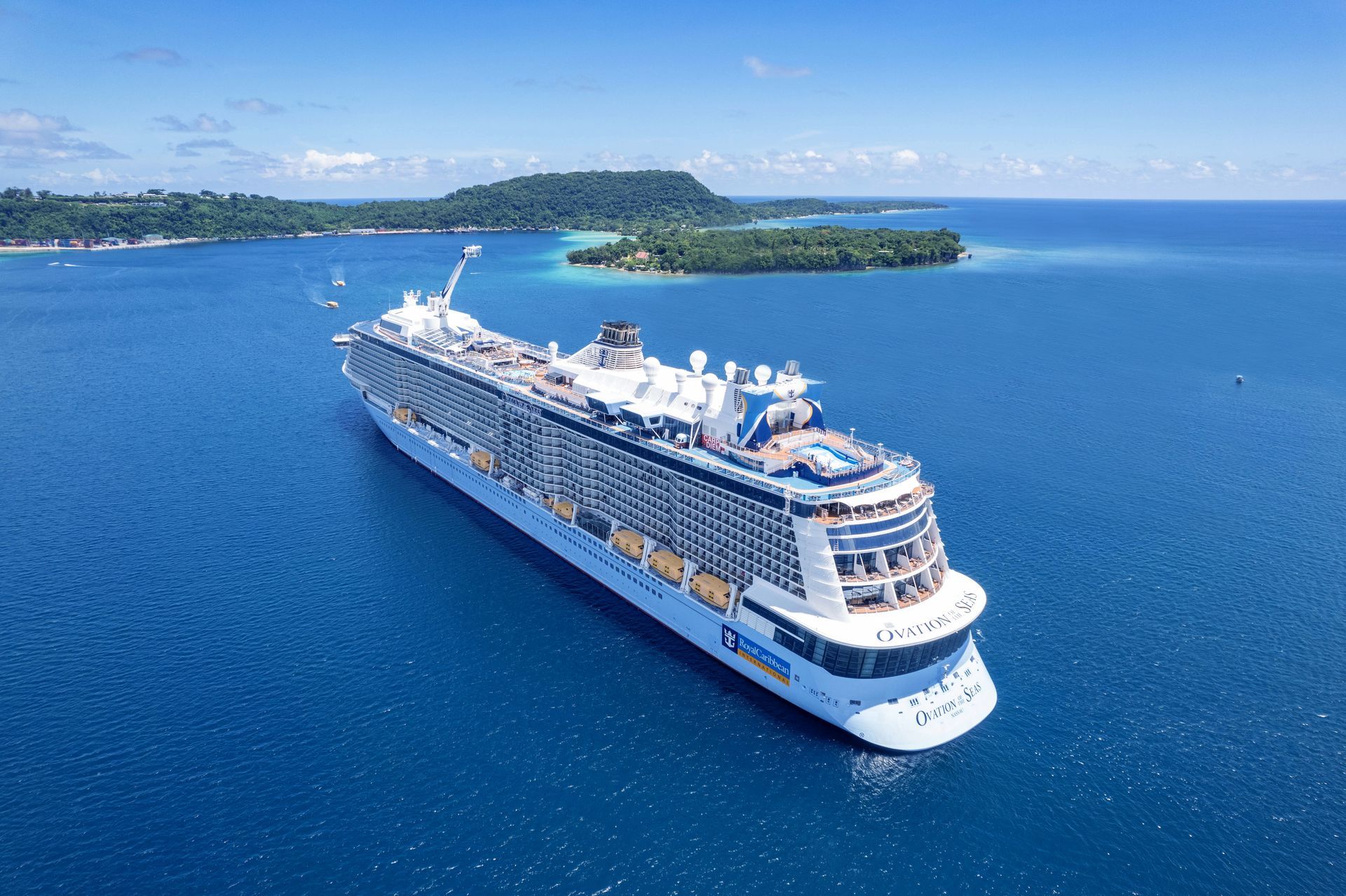 An aerial view of a cruise ship in the ocean.
