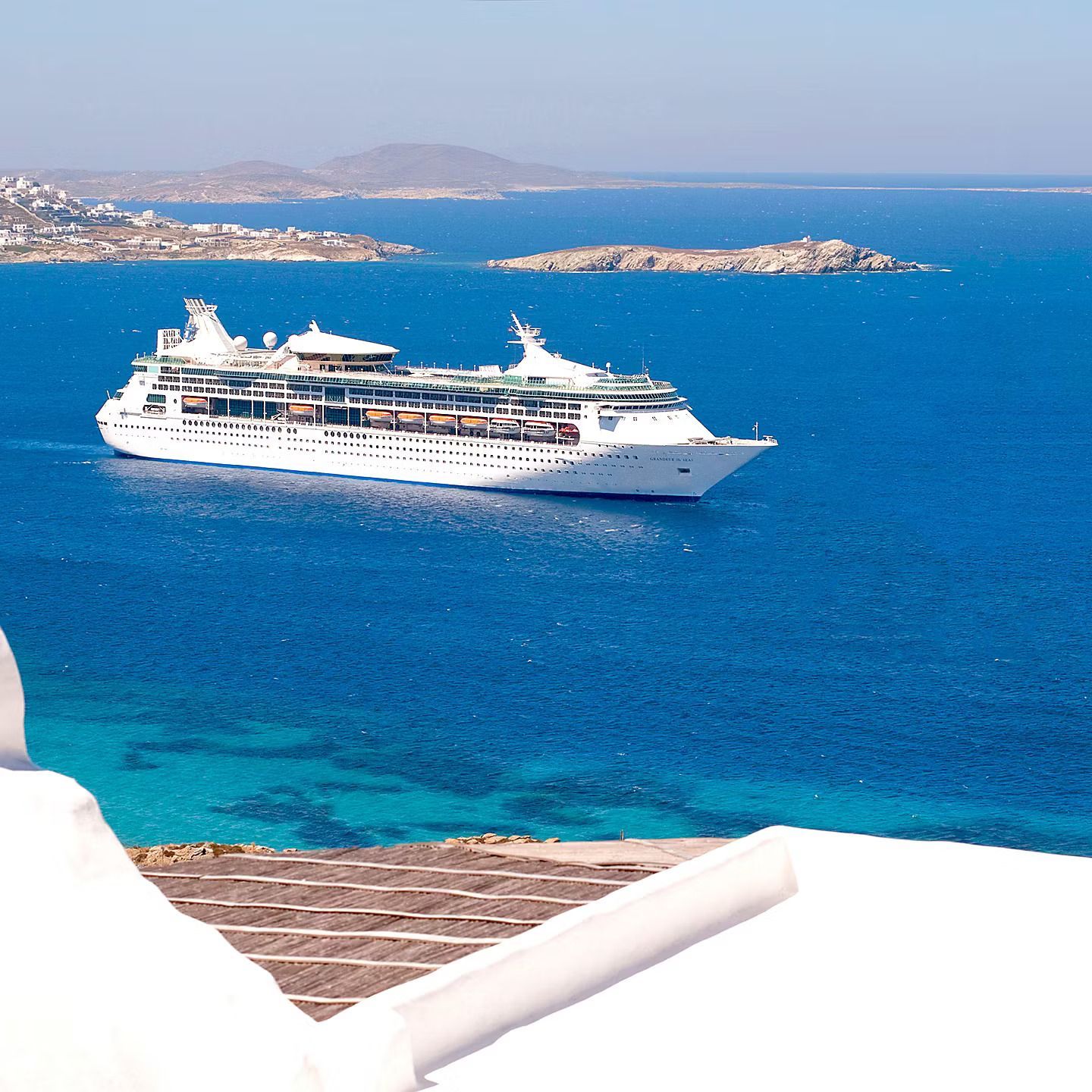 A large cruise ship is floating in the ocean