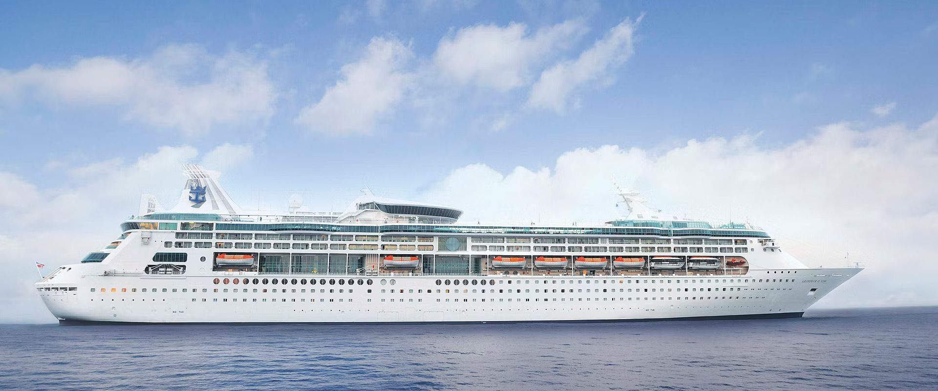 A large cruise ship is floating in the ocean