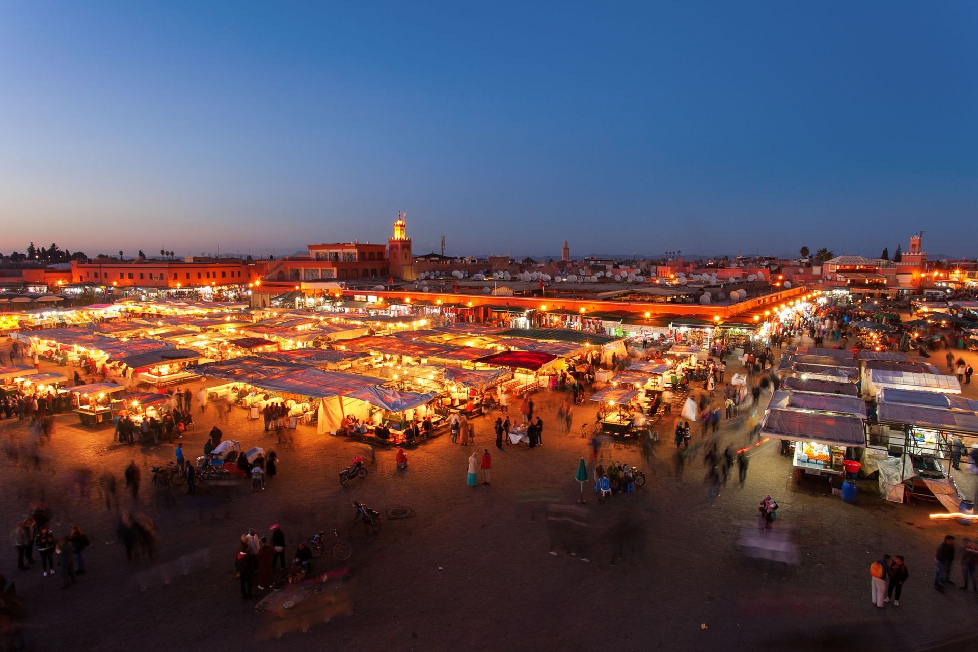 An aerial view of a crowded market at night.
