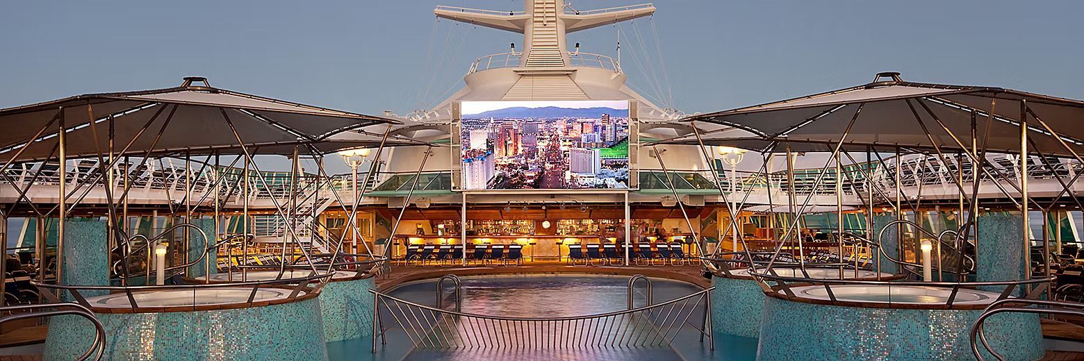 A large swimming pool with a large screen on top of it.