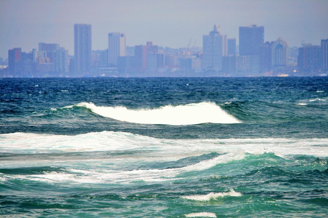 Blue sea with Durban Skyline in the background.