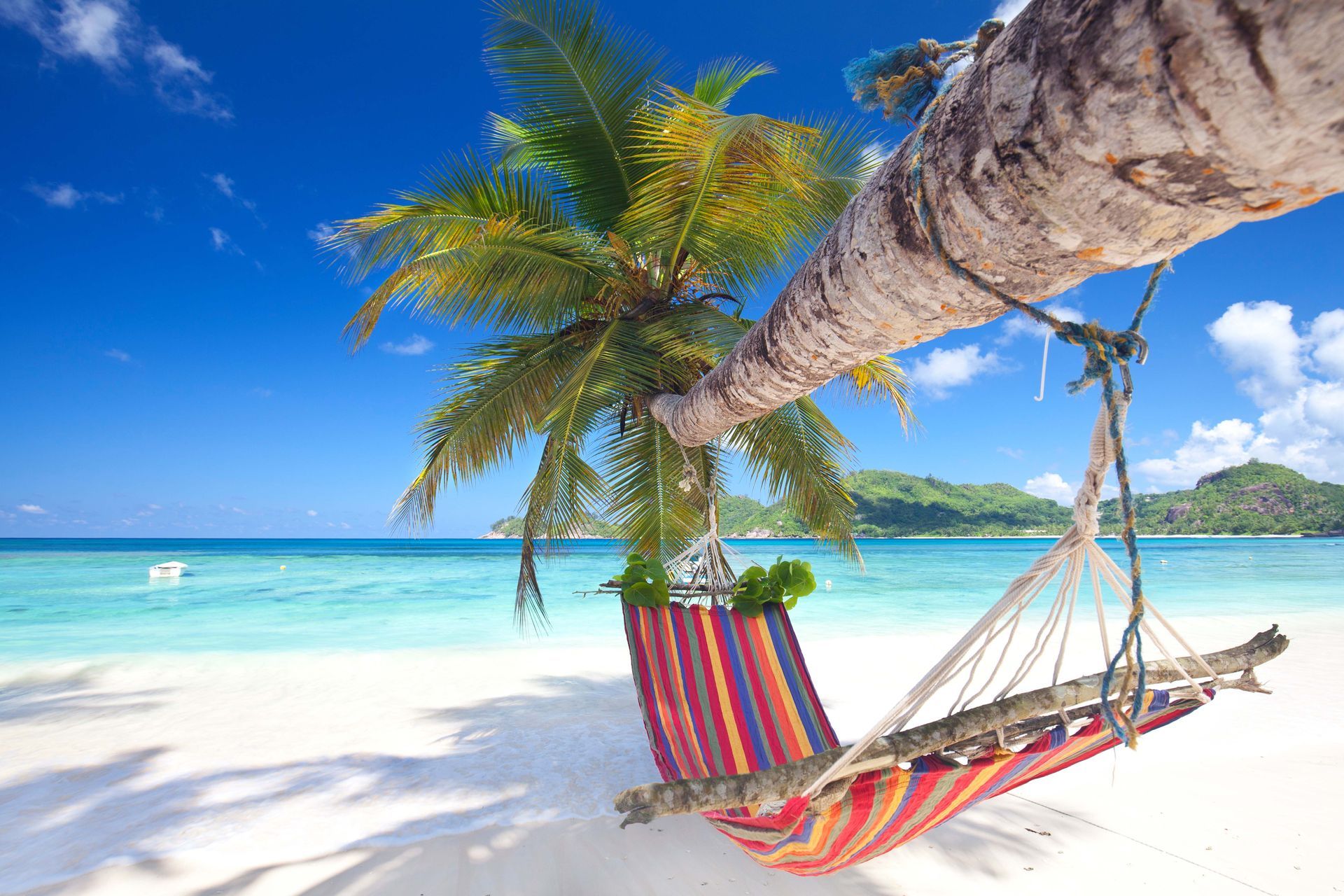 A hammock on a beach in Seychelles, situated in the Indian Ocean.