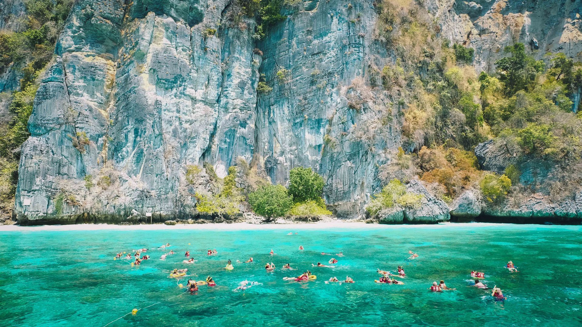 Tourists snorkelling on the way to Phi Phi Island in Krabi province, Thailand.