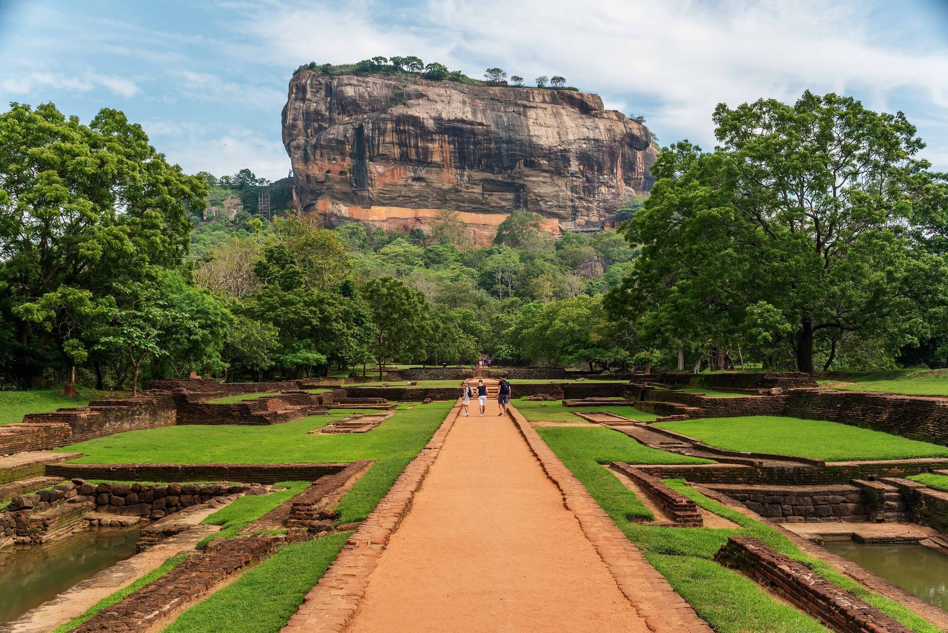 View of Sigiriya fortress in Sri Lanka from a pathway.