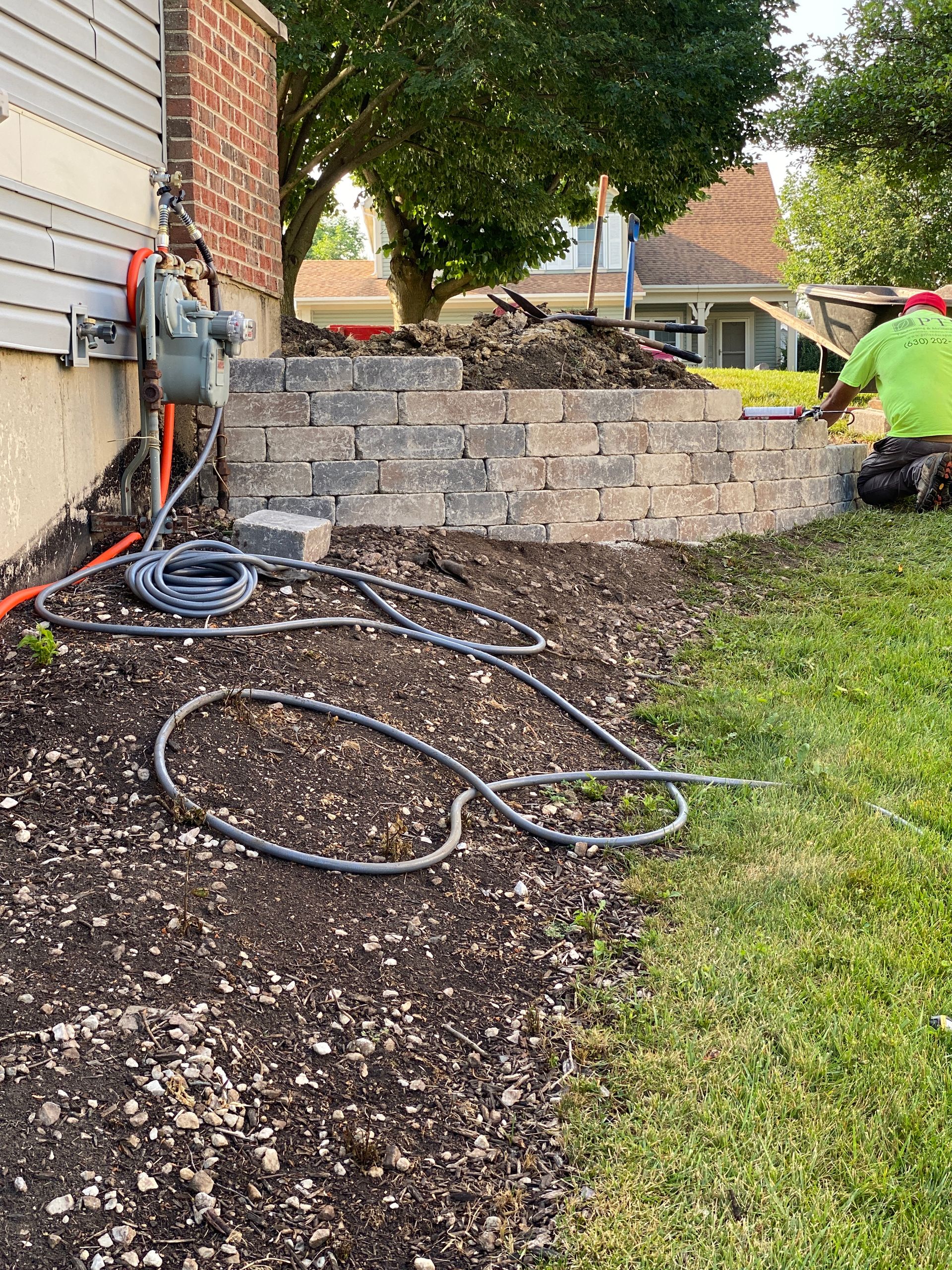 Retaining wall installation for your sloped yard | PTL Landscaping