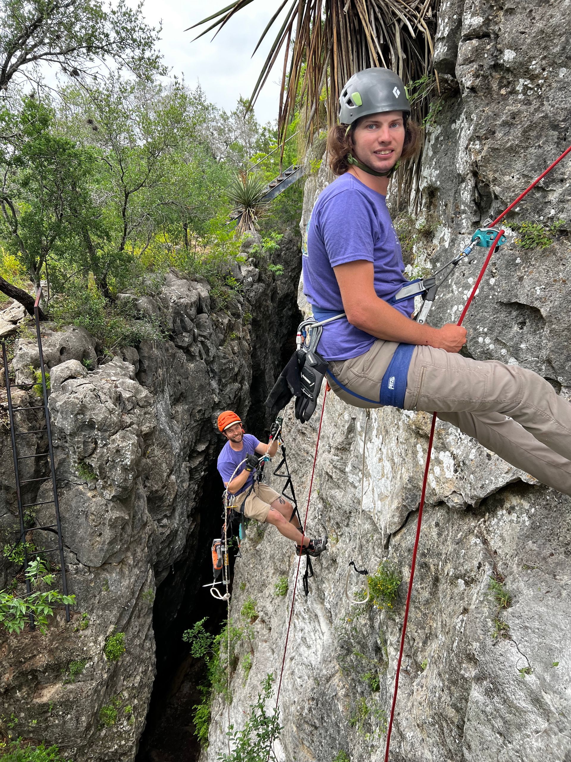 Kids climbing outdoors with a guide near Austin