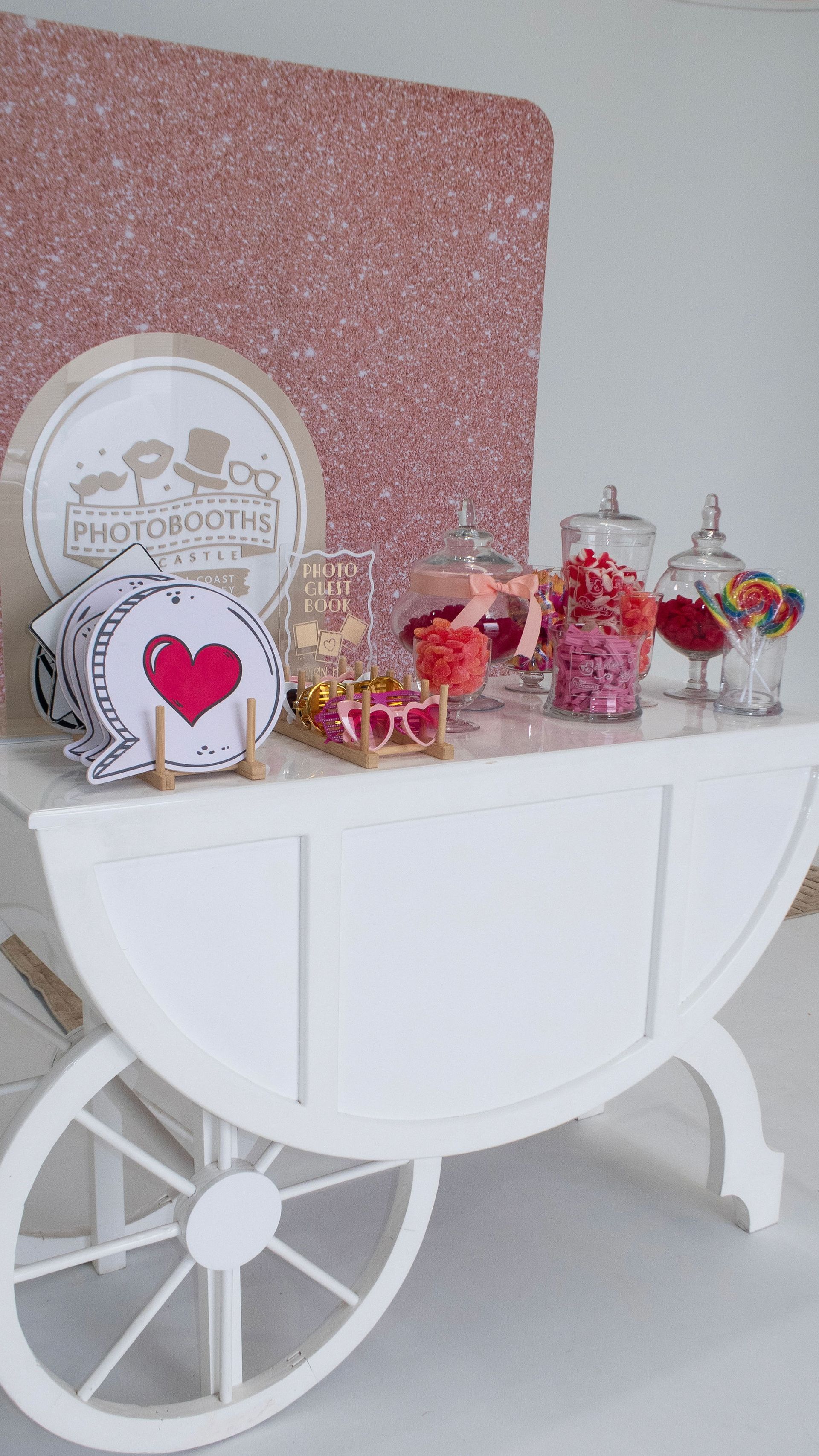White cart with candy jars and 