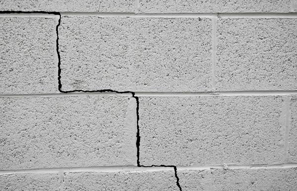 Foundation Repair — Worker Levels a Floor with Cement in Deptford, NJ