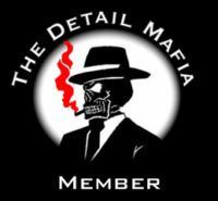 Logo of The Detail Mafia Member featuring a skull in a hat and suit smoking a red cigar, set against a circular background.