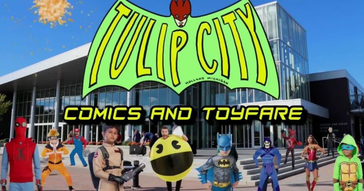 A group of people in superhero costumes stand in front of a modern building for the Tulip City Comics and Toyfare event.