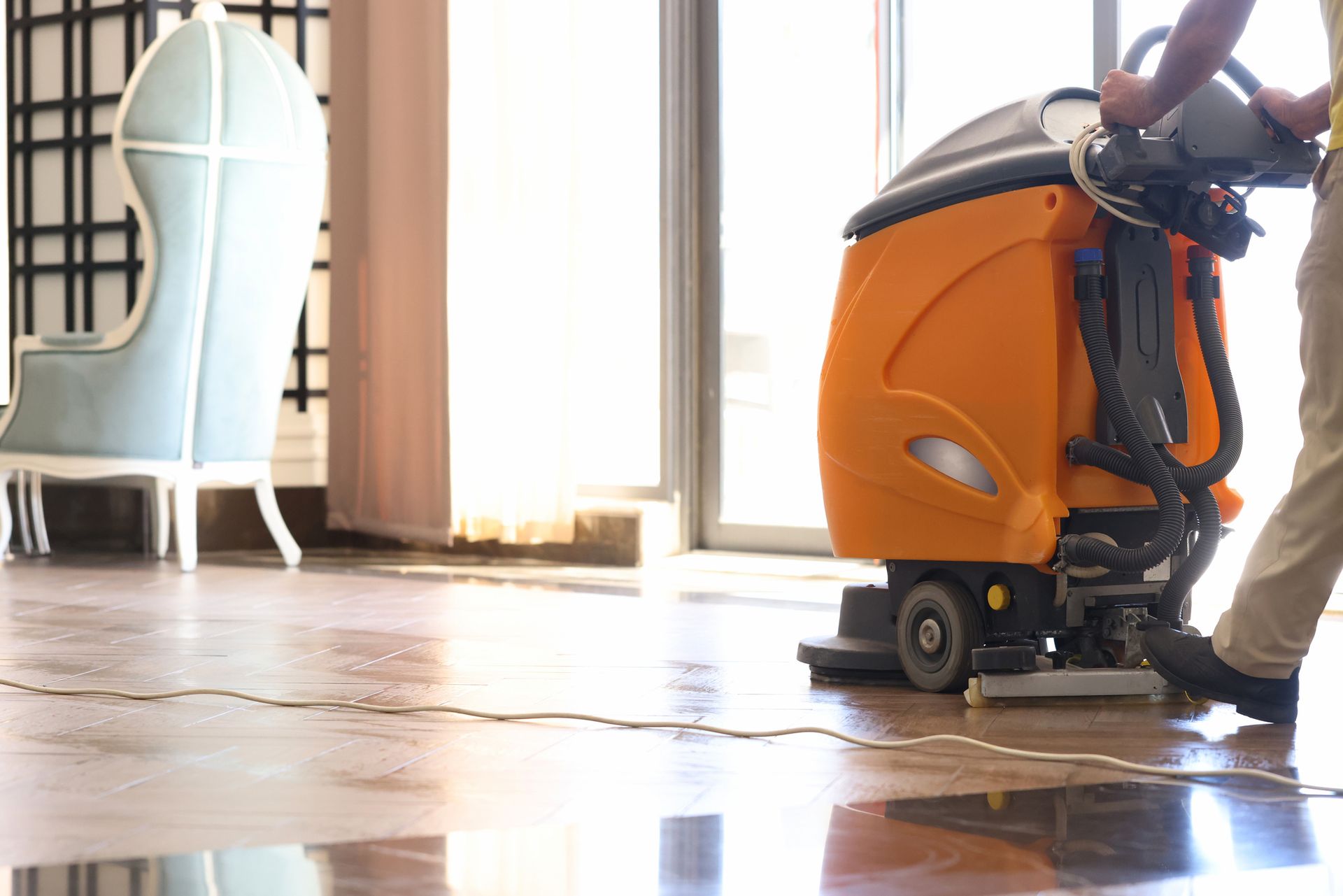 Cleaner Washing Floor in Hotel Using Special Machine Closeup | Clayton, NC | Showcase Professional Services Cleaner Washing Floor in Hotel Using Special Machine Closeup | Clayton, NC | Showcase Professional Services