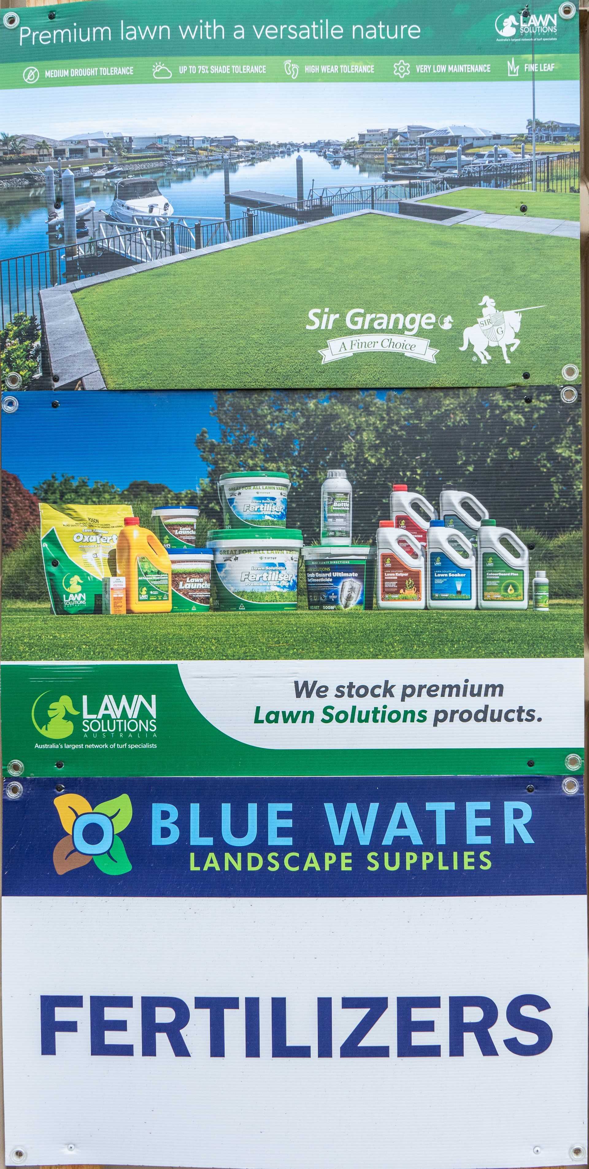 Blue Water Landscape Supplies ad with landscaping photos and large “FERTILIZERS” text