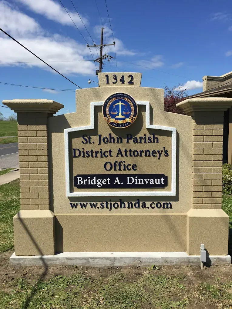 St. John Parish District Attorney’s Office sign with address 1342 and website in Bridgeton, LA.