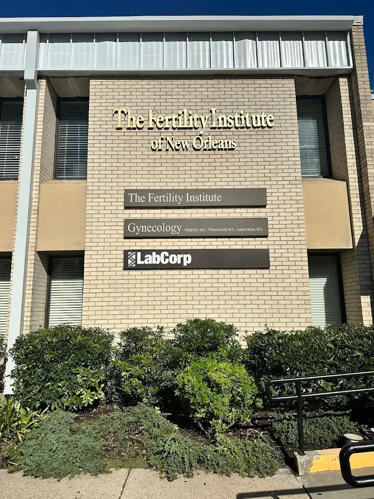 Building sign for The Kensington Institute, Texas Tech Health, and LabCorp on a tan brick exterior.