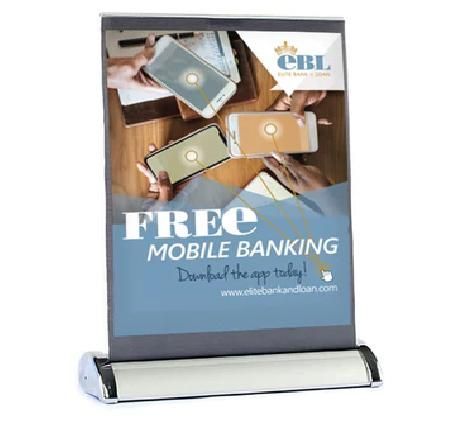GTBank promo poster reading “FREE MOBILE BANKING” with phones and hands on a stand