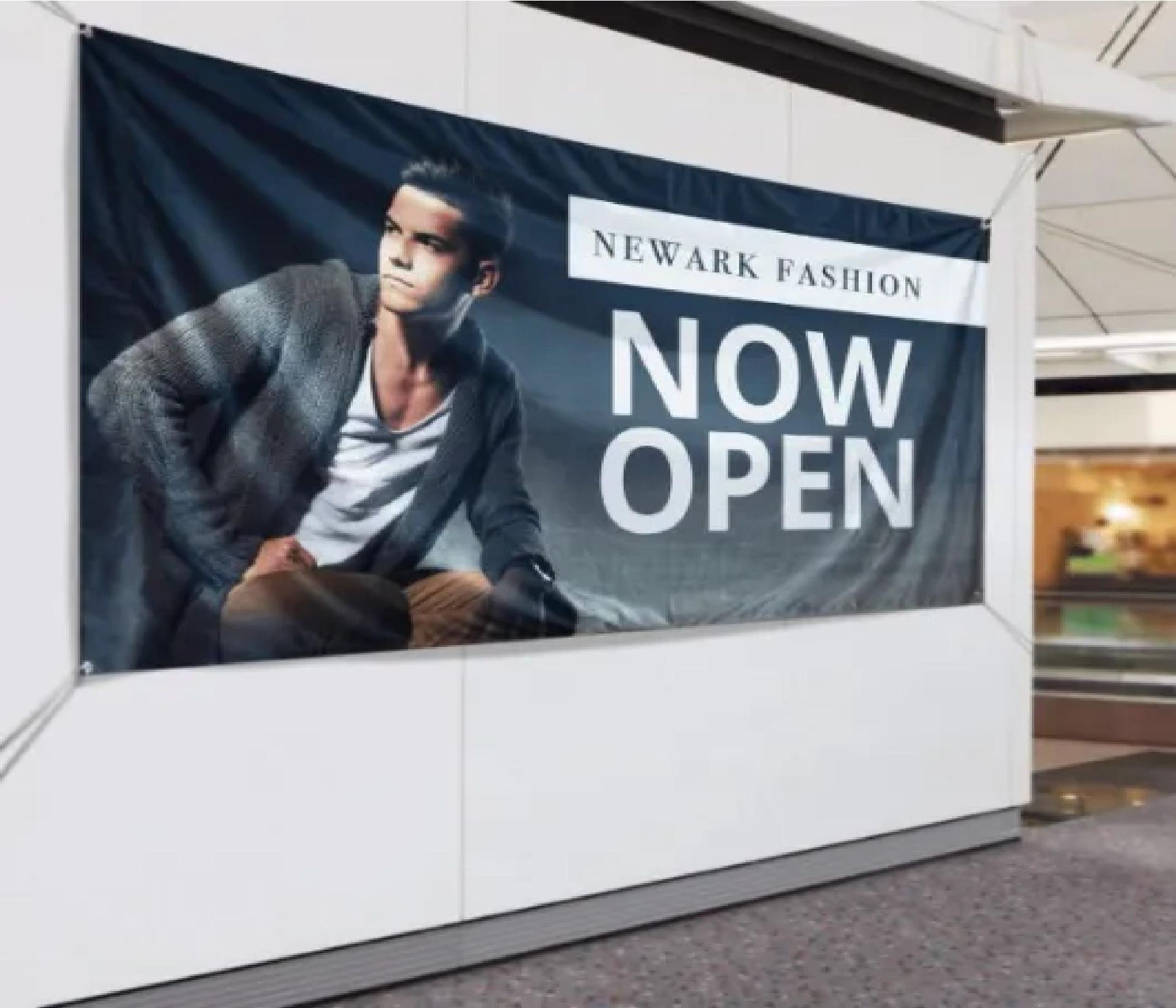 Newark Fashions storefront banner with model and bold “NOW OPEN” text