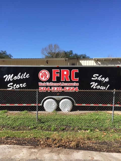 Black trailer sign for FRC mobile store, with phone number and “Shop Now!” text