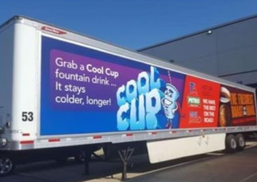 Red Cool Cub trailer ad in blue and white, with the slogan “Grab a Cool Cup fountain drink. It stays colder, longer!”