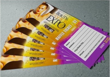 Stack of purple and yellow beauty salon gift vouchers on a gray surface