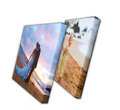 Two wall canvas prints: sunset beach couple scene and beach wedding portrait